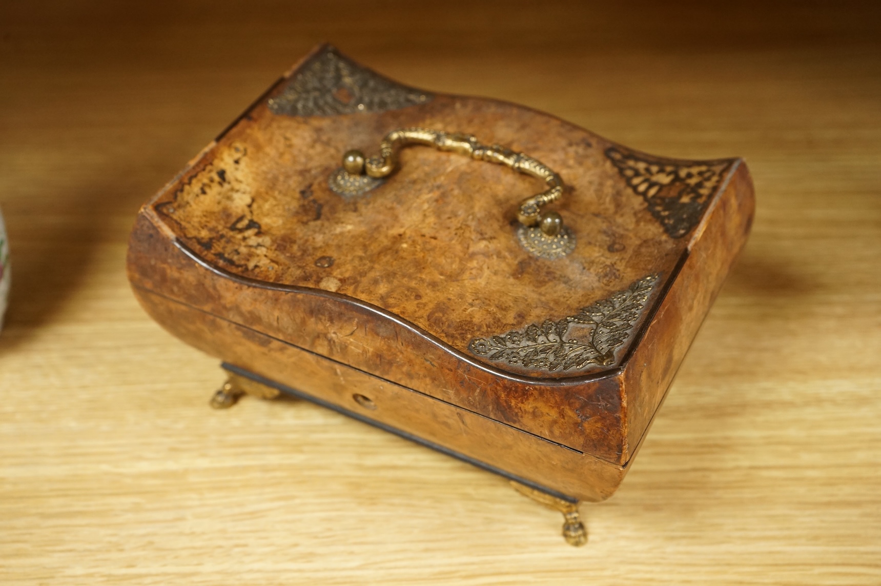 A 19th century burr walnut musical sewing box with mirrored and fitted interior and two silver keys, 18cm wide (mirror cracked)